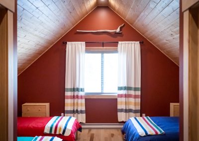 bedroom with HBC blankets, cabin builders, AXM Contracting
